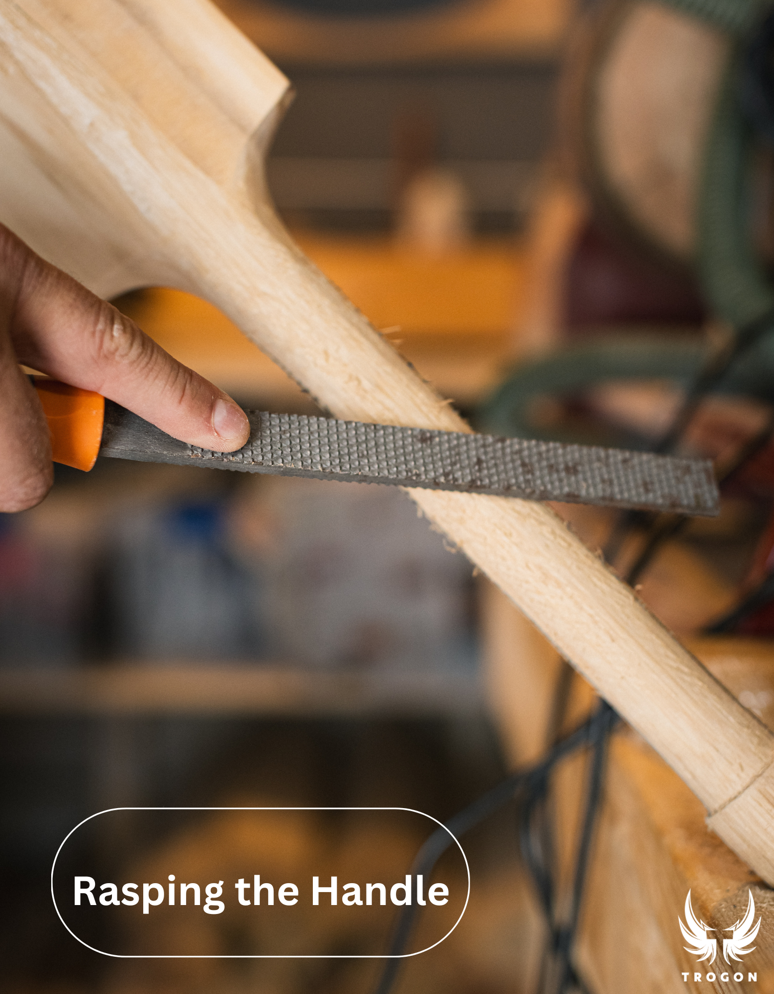 Hand using a sanding block to rasp a wooden handle, with 'Rasping the Handle' text - Trogon Cricket