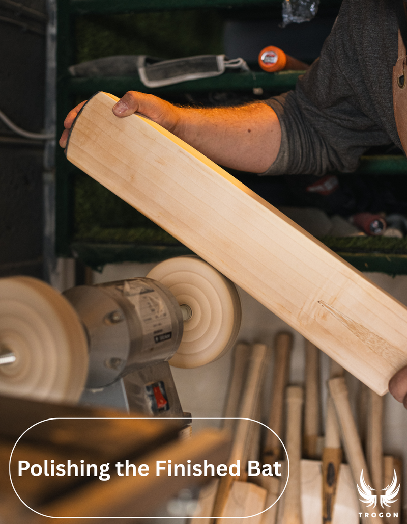 Person polishing a wooden bat with a buffer in a workshop setting - Trogon cricket