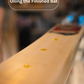 Close-up of a wooden bat with oil applied, blurred background - Trogon finished cricket bat