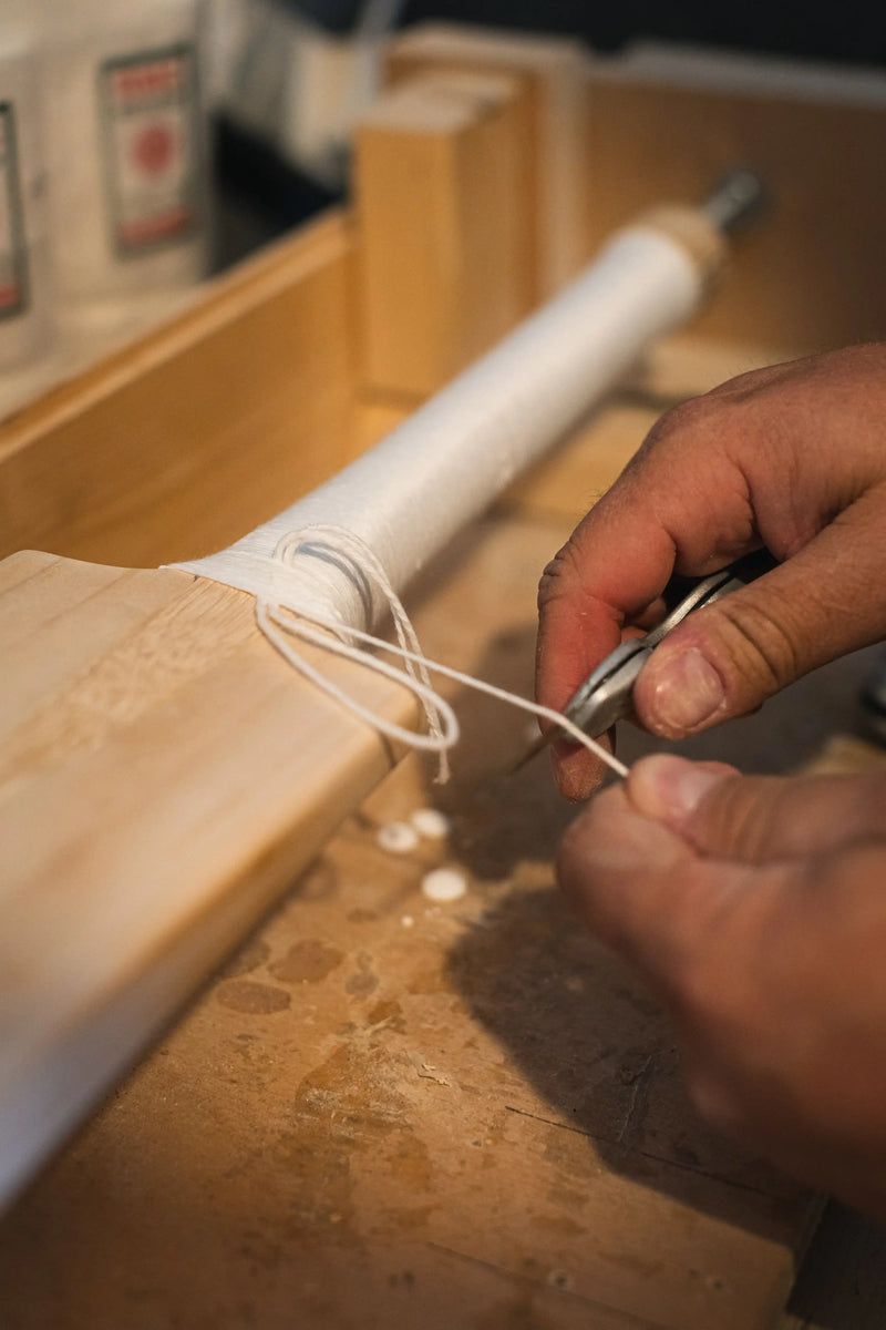 Binding a cricket bat handle using a custom made lathe